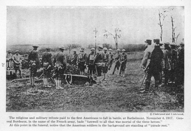 The religious and military tribute paid to the first Americans to fall in battle, at Bathelmont, November 4, 1917.  General Bordeaux, in the name of the French army,  bade "farewell to all that was mortal of the three heroes."  At this point in the funeral, notice that the American soldiers in the background are standing at "parade rest."