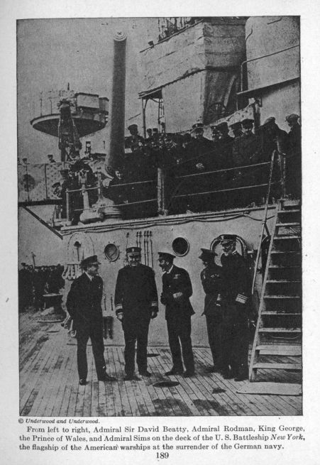 From left to right, Admiral Sir David Beatty, Admiral Rodman, King George, the Prince of Wales, and Admiral Sims on the deck of the U. S. Battleship New York, the flagship of the American warships at the surrender of the German navy.