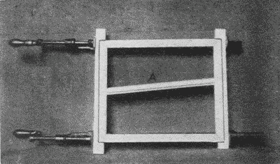 Fig. 253. Gluing Together a Picture-Frame (See also Fig. 254.)