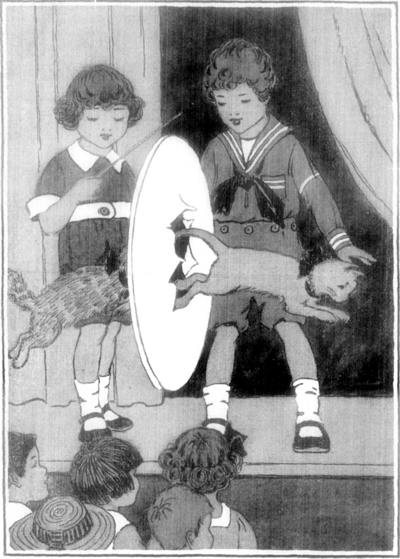 ONE OF THE TRICKS WAS TO RUN AND JUMP THROUGH A PAPER HOOP.
"The Curlytops and Their Pets"              Page 240
