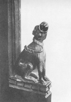 Carved wooden figure of the pedlar's dog in Swaffham Church.