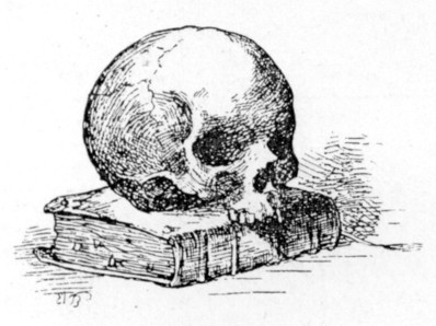human skull missing lower jaw resting on a book