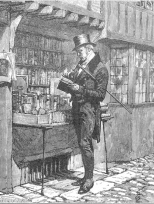 man examining a book in a bookshop
