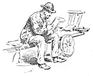 man sitting on empty book-barrow reading
