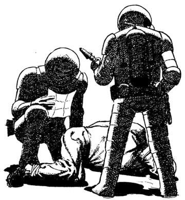 Two figures dressed in spacesuits and with rifle-like weapons are standing over a man who is tied up and on the ground.