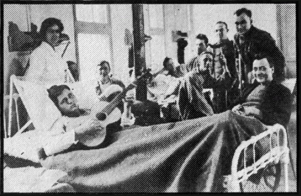 Ward in an A.E.F. Hospital, Showing Some of the First to
Pay a Visit to "Blighty."