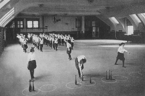 plate: Children in gymnasium doing a relay race