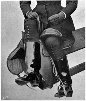 Woman sitting on a side-saddle resting on a stand to demonstrate the grip.