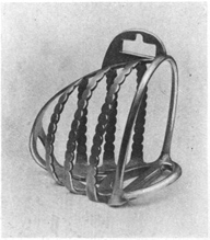 Stirrup iron with enclosed area for toe, but not solid metal.