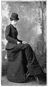 Woman standing with leg lifted to show opening in skirt.