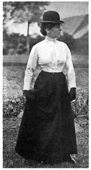 Front view of standing woman, without a jacket