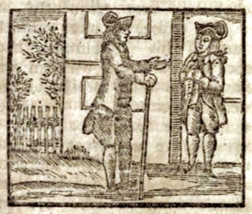 Two men standing, facing each other