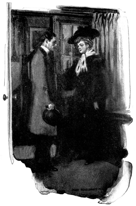 A man and a woman talk by a door.