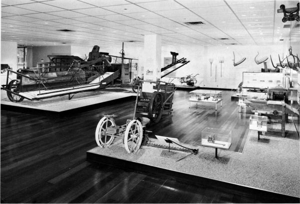 Figure 20.--A view in the Hall of Farm Machinery, National Museum of History and Technology.
The Holt combine in 1887 (Catalog No. 241) is at left. The Victor mowing machine of 1880
(Catalog No. 137) is in right foreground.