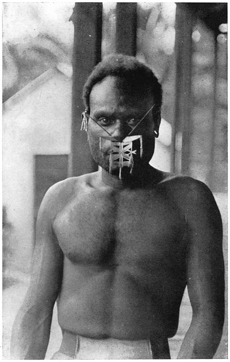 MAN FROM NITENDI, WITH PEARL SHELL NOSE ORNAMENT FOR DANCING.