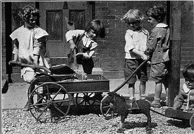 Children playing with wagon.