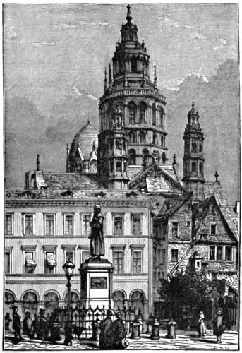 Large buildings, with a statue outside