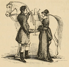 Woman standing next to horse, ready to mount, with groom ready to assist