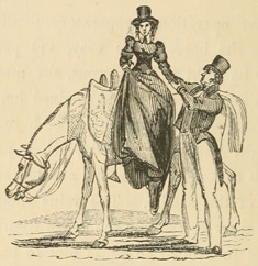 Woman dismounting, with a man helping