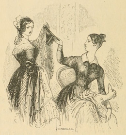 Two women passing a hat and veil between them
