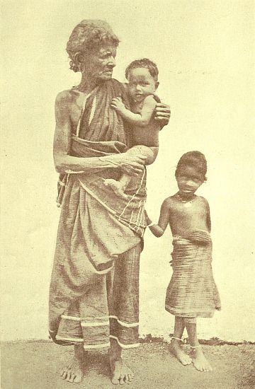 An ancient Pariah, but the baby in her arms is a son of the Caste of Palmyra Climbers. Both faces—the old crone's and the baby boy's—are very typical. The baby is a "Christian," I should explain, and his parents are true Christians, otherwise the Pariah woman would not have been allowed to touch him.
