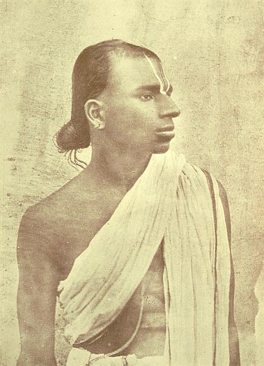 A typical Brahman student. The marks on the forehead are made of bright red, yellow, and white paste, and represents the footprint of the god Vishnu. These Brahmans are Vaishnavites.