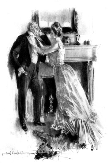 A young woman and old man face each other, standing in front of a fireplace. Her hands are on his jacket lapels.
