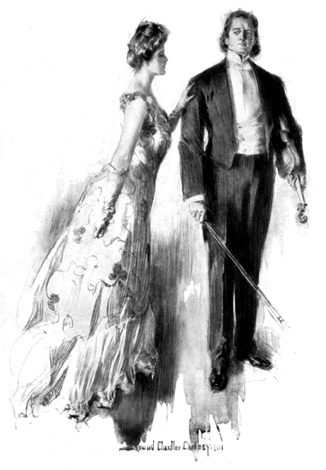 A woman in evening dress lays her hand on the shoulder of a man holding a violin under his arm.