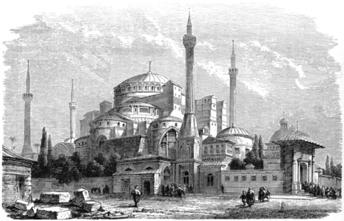 Mainly curved walls on the buildings; four minarets are visible
