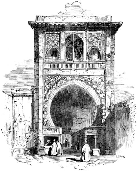 Showing large archway surrounded with decoration