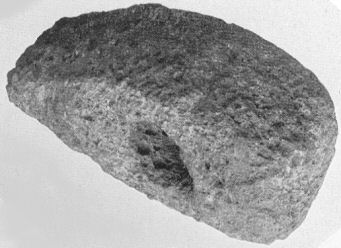 Hammer Head, found near the Wong, length 6⅝-in., width
3⅞-in. weight 3½-lb.; of porphyry from the Cheviot
region, Neolithic period.  The stone was probably part of a large
boulder