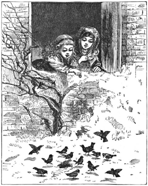 Two girls lean out of a window to feed birds