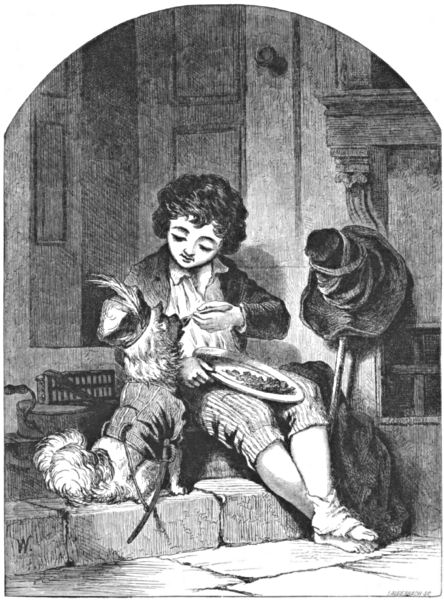 The boy feeds his dog scraps from his plate