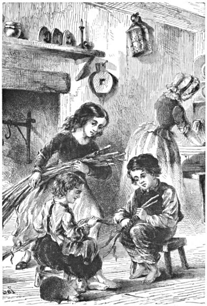Three children holding firewood, in front of the fireplace with a cat