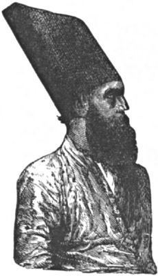 A Parsee man wearing one of the distinctive tall hats