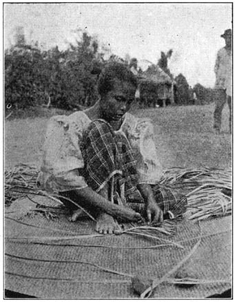 Plate XLV. Weaving a karagumoy mat, Tabaco, Albay.