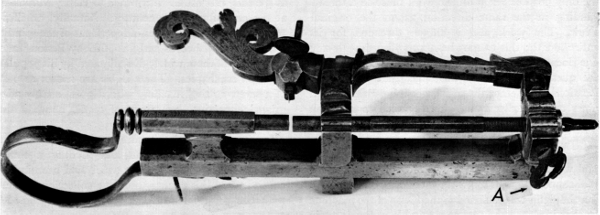Figure 3.— Small thread-cutting lathe which was made to
be held in a vise during use. It was found as shown here, with only the
operating crank missing. The overall length is approximately 12 inches,
depending on the adjustment of parts. (Smithsonian photo 46525B.)