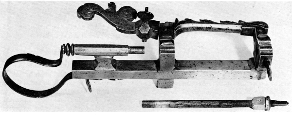 Figure 5.—Spring for keeping the follower spindle
against the work, showing the method and range of adjustment. Note the
rectangular projection to engage a mating socket in the spindle, to
prevent spindle rotation. (Smithsonian photo 46525.)