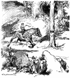 Killis is aiming his gun at a tree, while galloping on a horse.