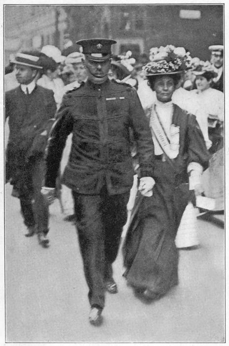 INSPECTOR WELLS CONDUCTING MRS. PANKHURST TO THE HOUSE OF
COMMONS June, 1908