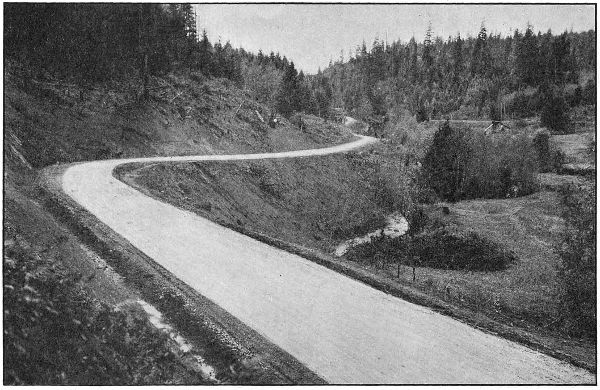 THE PACIFIC HIGHWAY IN PASS
CREEK CANYON, DOUGLAS COUNTY. GRADED AND MACADAMIZED IN 1917 AND 1918