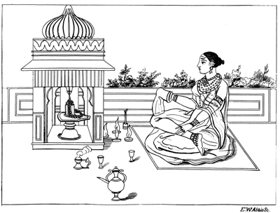 A woman is seated before a shrine.