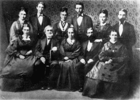 Standing: Matt (Mrs. W. B. Smith), R. A. Carr, Mrs. O. A. Carr, O. A. Carr, Mrs. H. P. Carr, Owen Carr.
Sitting: Mary (Mrs. Goddard), Wm. Carr, Mrs. Wm. Carr, Capt. H. P. Carr, Minnie (Mrs. Jno. W. Fox, Sr.)
HOME AGAIN—ALL HERE