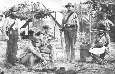 Ill-clad and poorly equipped, Confederate volunteers at Pensacola, Florida, wait
their turn for the smell of black powder.
