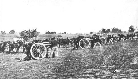 Artillerymen soften an objective for the infantry. Although field artillery was used extensively, it fcenterened and demoralized more
men than it wounded. Only 20 per cent of the battle casualties can be attributed to the artillery.
