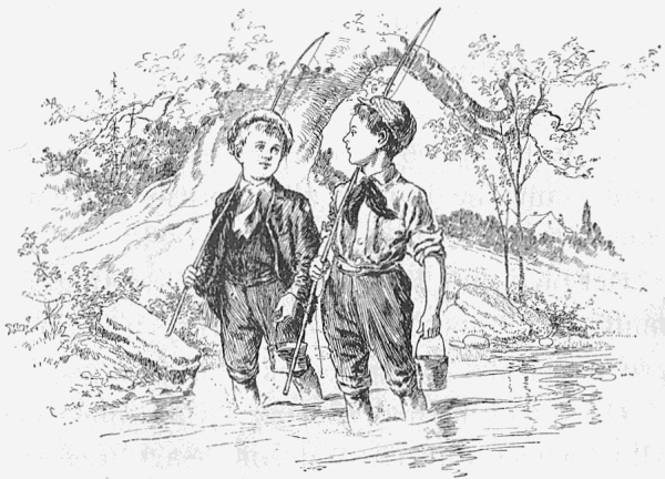 Two boys with fishing poles walking in a creek
