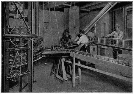 People filling small packs with salt