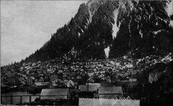 photo of city against foot of mountain