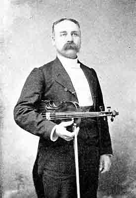 Tuxedo with waist buttoned vest; horizontal violin under right arm, vertical bow in right hand.