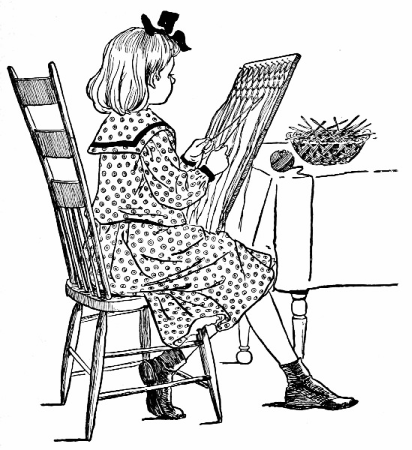 Girl sitting in chair making sash